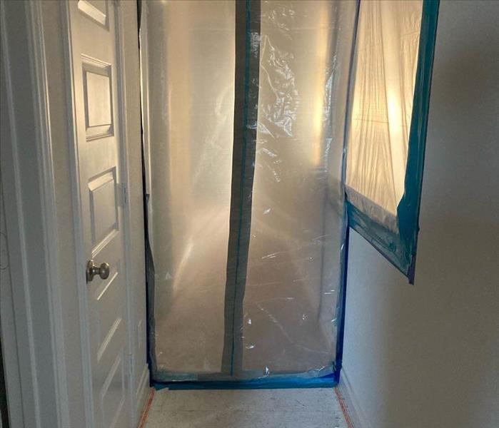 Mold containment in hallway.